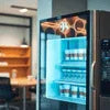 Coffee vending Faridabad featuring a black and silver office coffee vending machine with cold beverage display