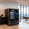 Atlantis Machine on Rent in Delhi black vending machine stocked with drinks and snacks in modern office space