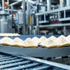 Premix Powder Gurgaon brand packaged in trays on conveyor belt for vending machines