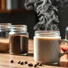 Office Coffee Premix Gurgaon in glass jars with steaming hot coffee and coffee beans on wooden table