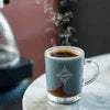 Atlantis Coffee Premix Gurgaon steaming black coffee in a clear glass cup for office use