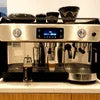 Silver DeLonghi coffee machine model with digital display and dual spouts for office coffee use Coffee Machine Rent Gurgaon