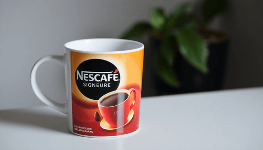 A coffee cup with Nescafe Signature Blend packaging