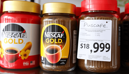 A jar of Nescafe Gold coffee with price tag