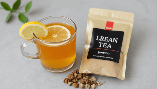 A cup of lemon tea with tea powder pack beside it