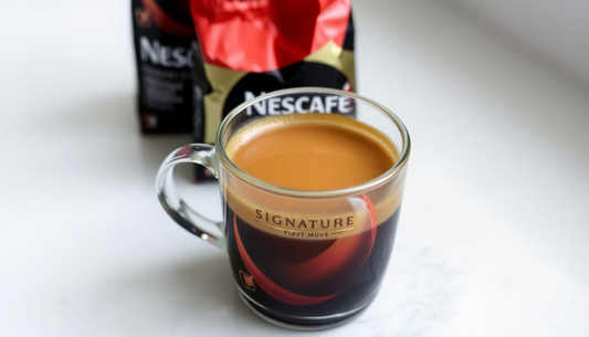 A cup of Nescafe Signature coffee with packaging