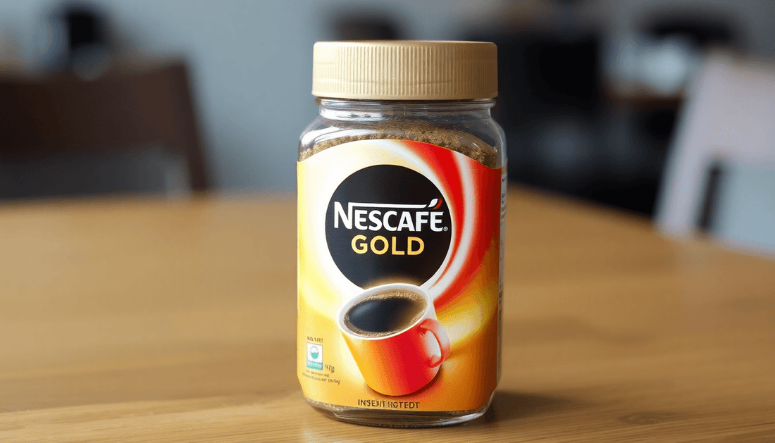A jar of Nescafe Gold instant coffee on wooden table