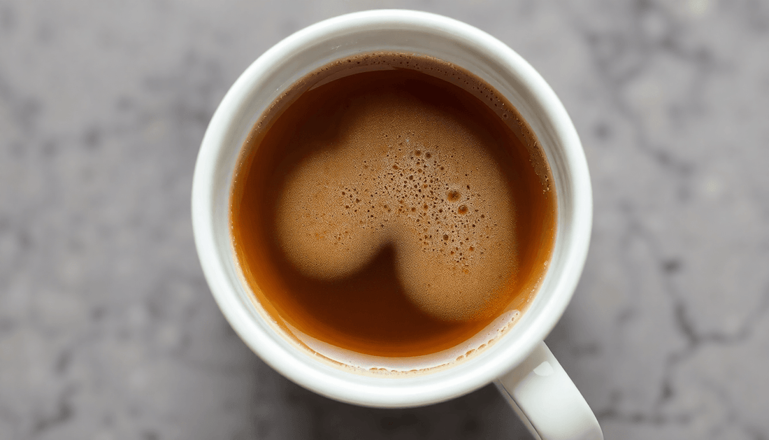 A cup of rich premix coffee with milk and sugar