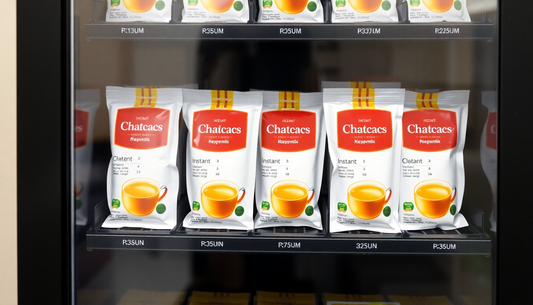 Display of Chatcacs instant chai premix packets neatly arranged in a vending machine in Sector 4 Noida