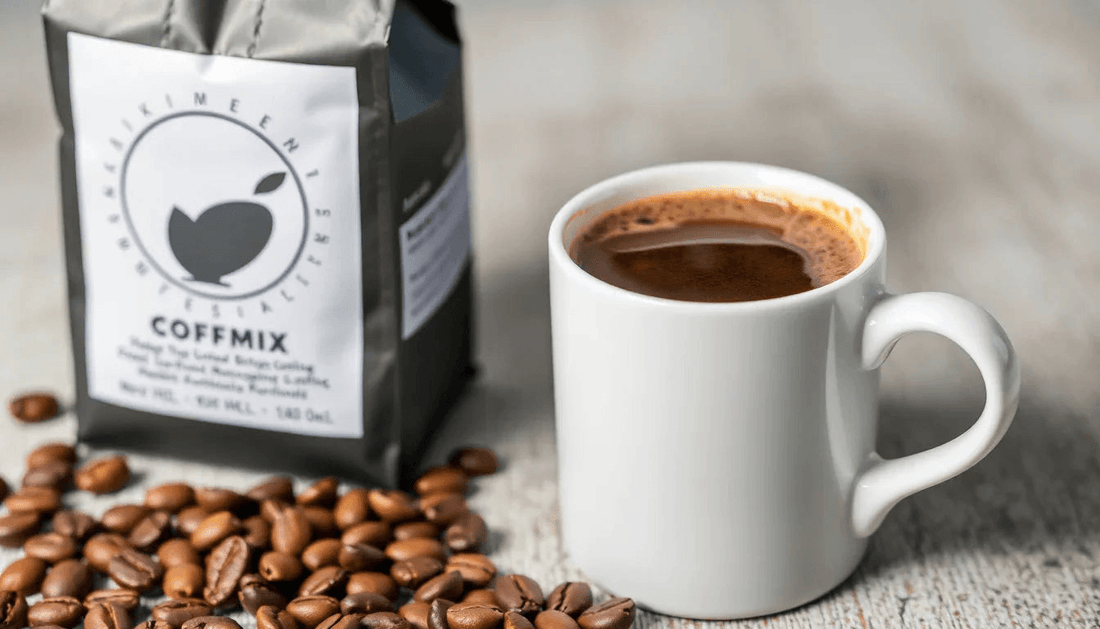 A cup of coffee premix with coffee beans and packaging