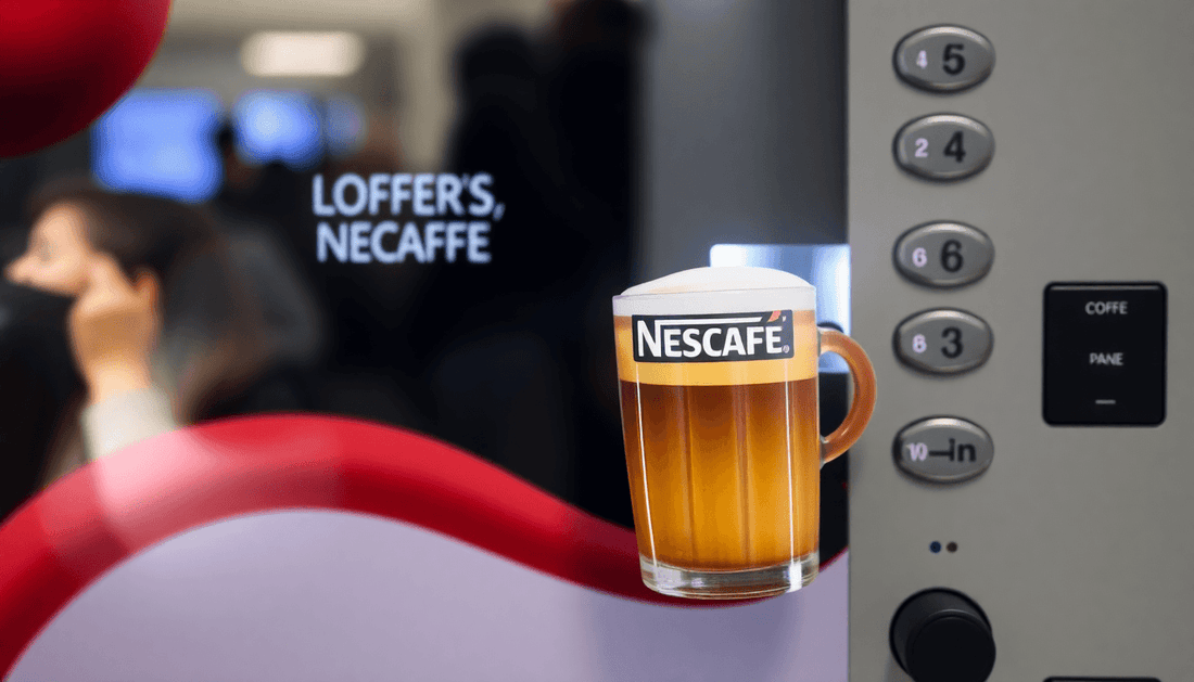 A Nescafe coffee vending machine dispensing coffee