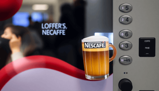 A Nescafe coffee vending machine dispensing coffee