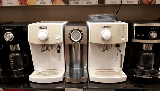 Godrej coffee machines displayed with price tags
