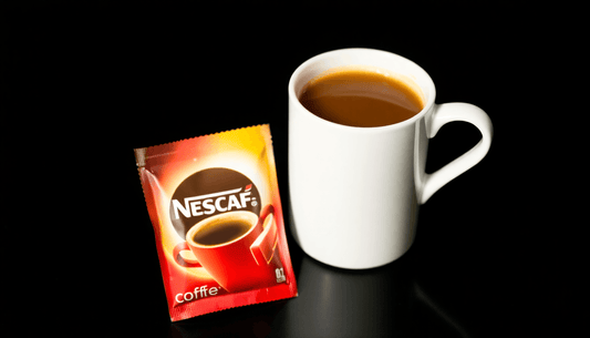 A Nescafe coffee premix packet beside a coffee cup