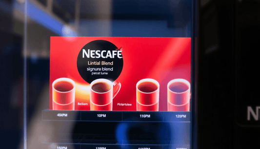 A vending machine dispensing Nescafe Signature Blend coffee