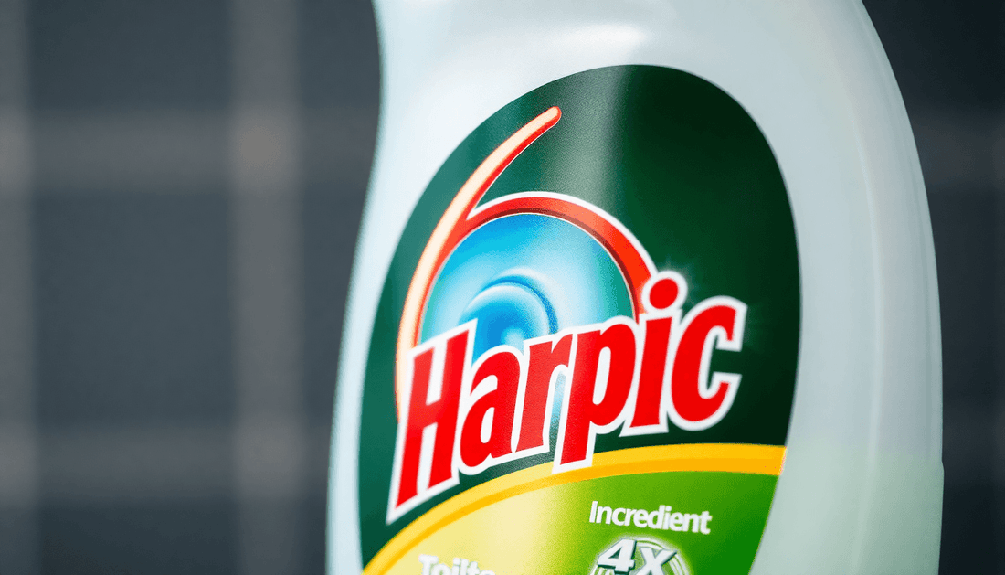 Close-up of Harpic toilet cleaner bottle with liquid ingredients