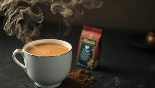 A cup of steaming chai with Atlantis chai powder pack