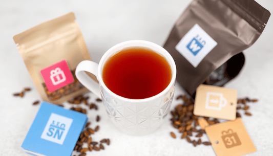 A cup of Assam tea with tea bags and online shopping icons