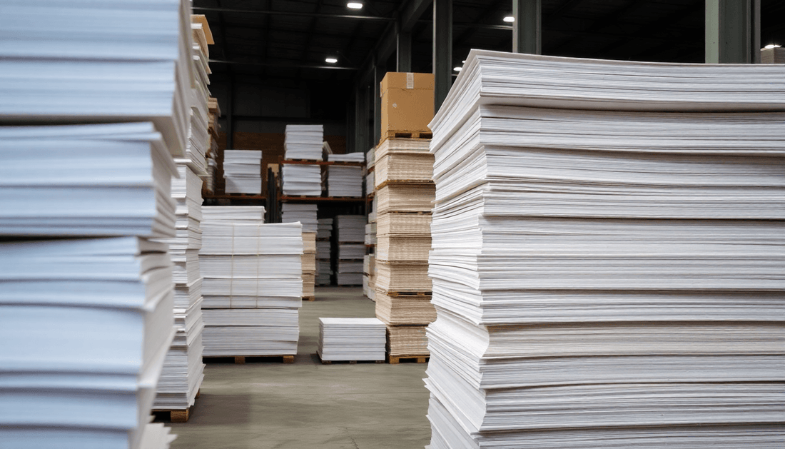 Stacks of eco-friendly paper sheets in a warehouse