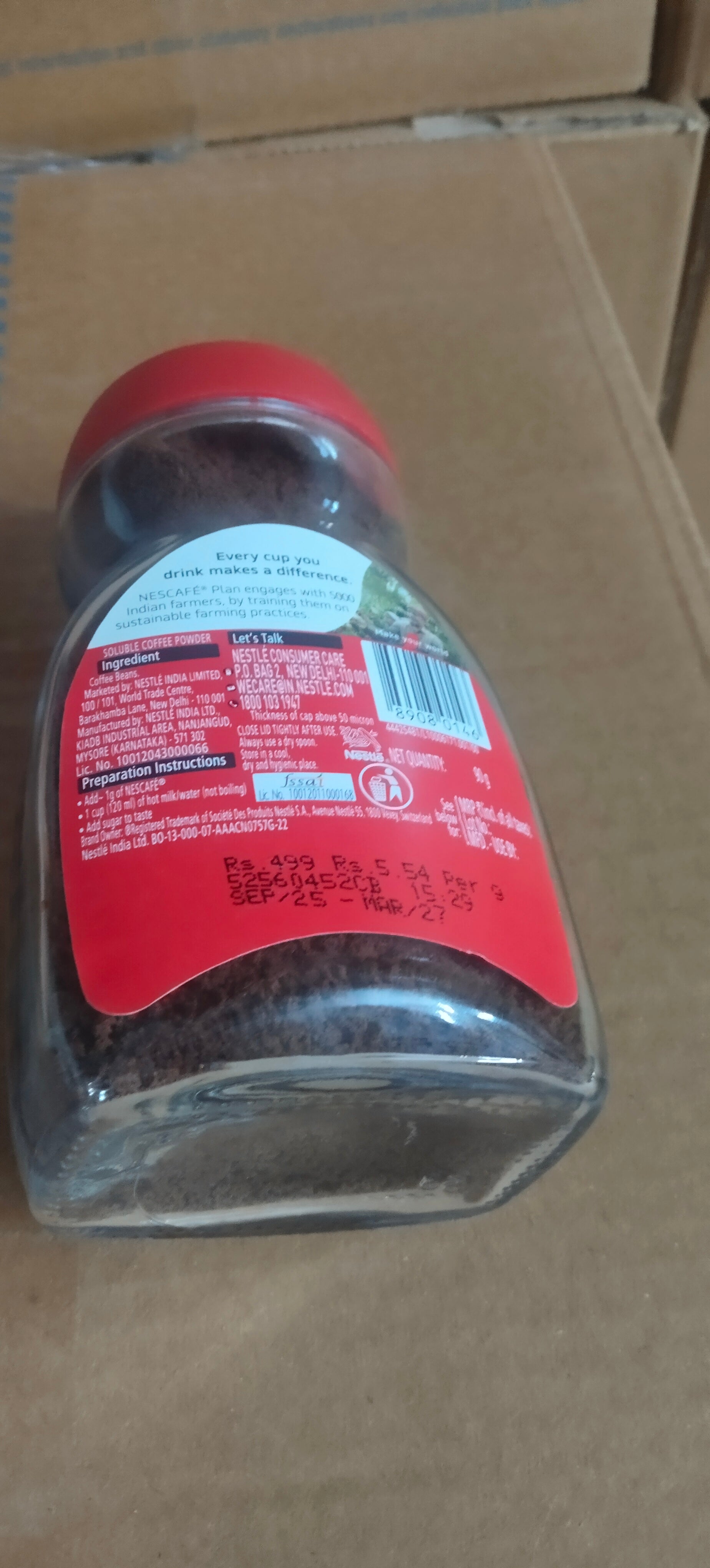 Glass jar of ground coffee with red lid showing label and information for Amazon vending coffee Noida