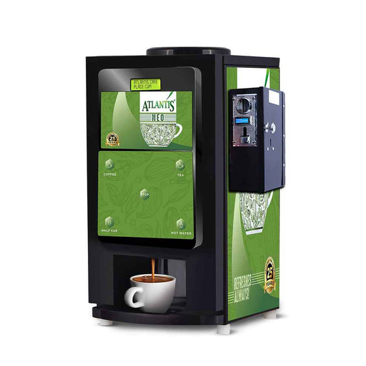 Atlantis coin operated coffee vending machine 2 lane with green front panel dispensing coffee into white cup