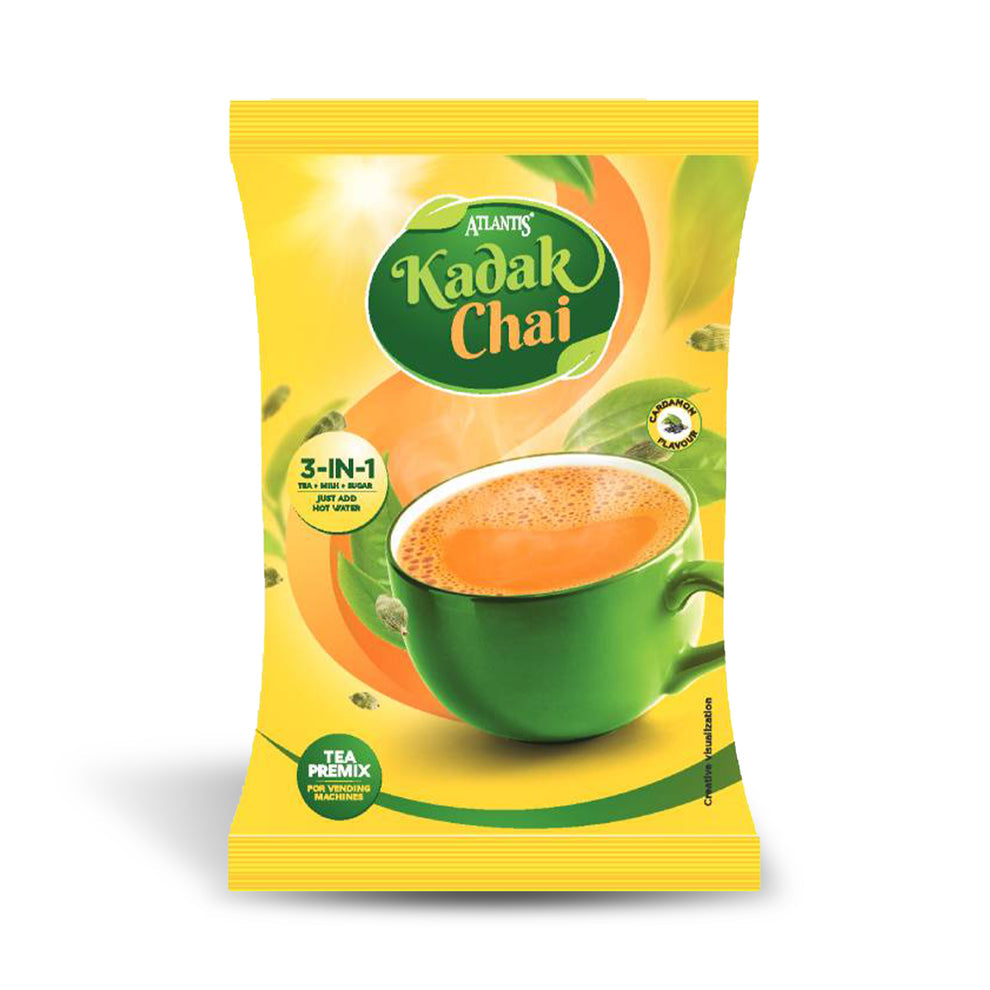 Atlantis Kadak 3-in-1 Tea premix packet with green cup of frothy tea on yellow background