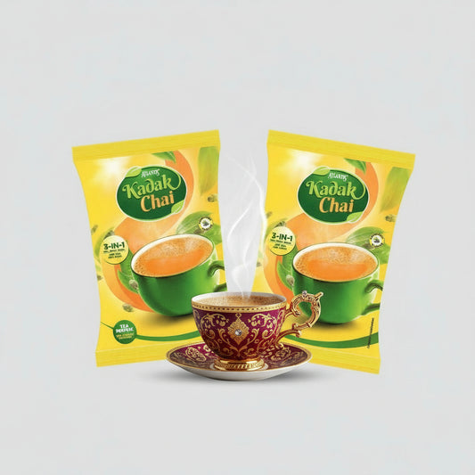 Atlantis Kadak Tea Premix 1 kg packets with steaming cup of tea in decorative cup and saucer