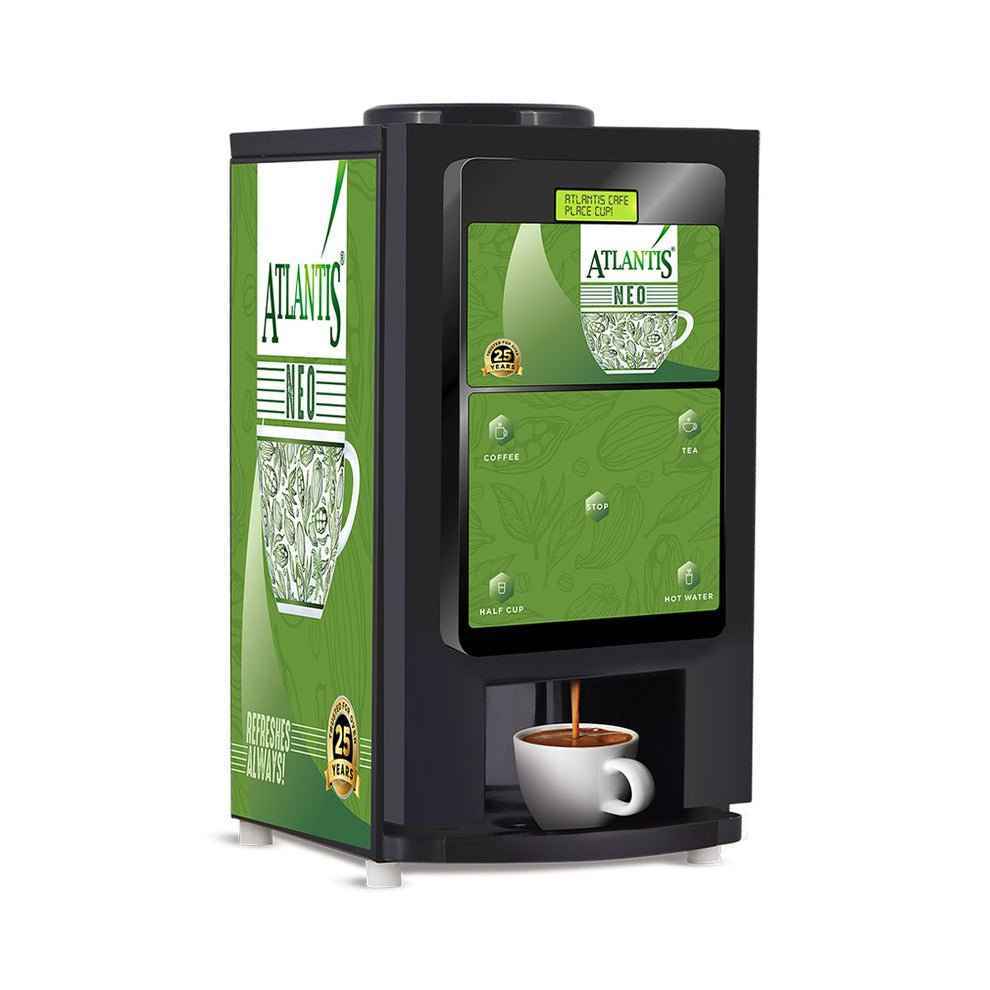 ATLANTIS NEO tea coffee vending machine dispensing coffee into white cup with green design