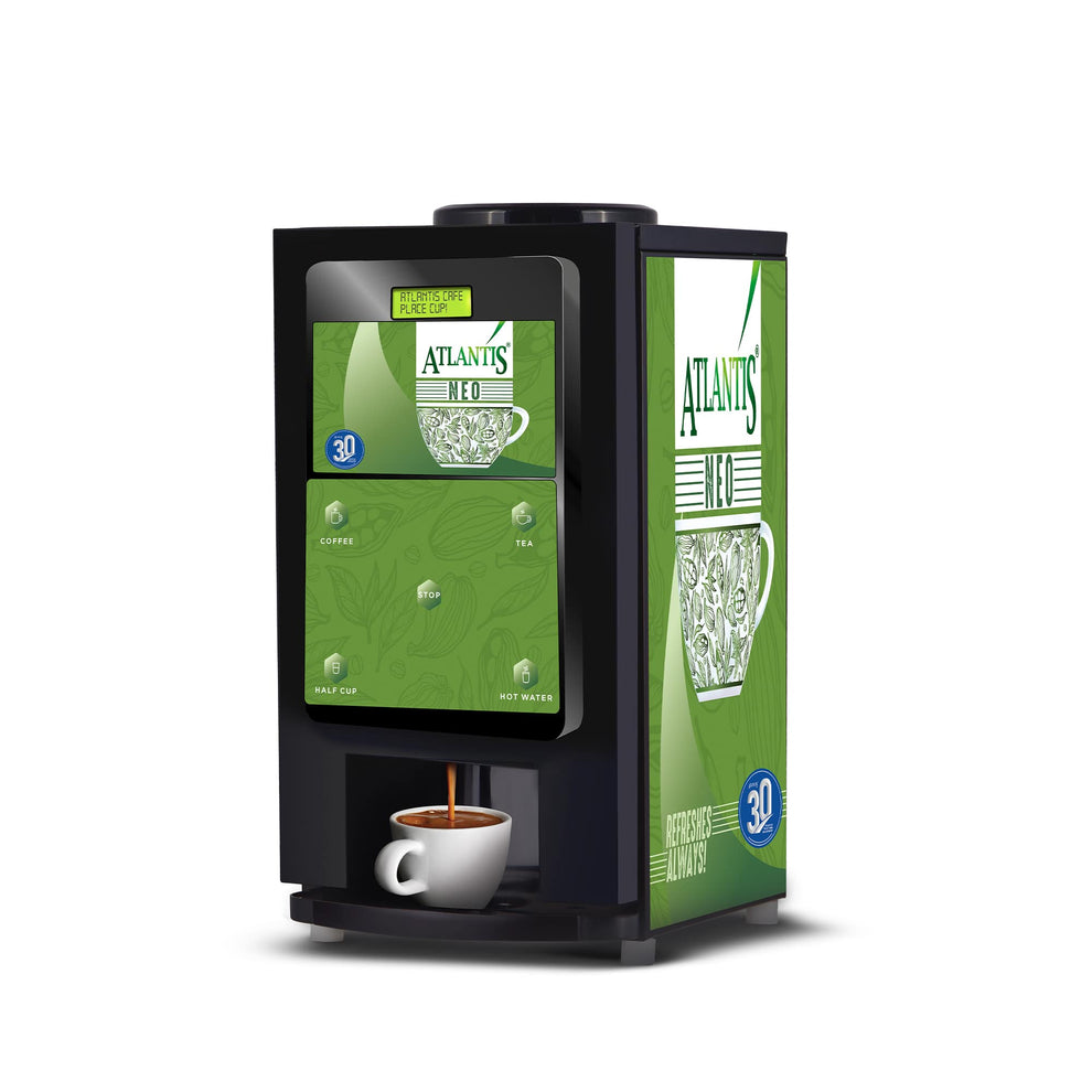 Atlantis Neo 2 coffee vending machine Noida in black with green panels dispensing coffee into white cup