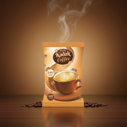 Atlantis online Kadak 3-in-1 coffee pack with steaming cup and coffee beans on wood surface