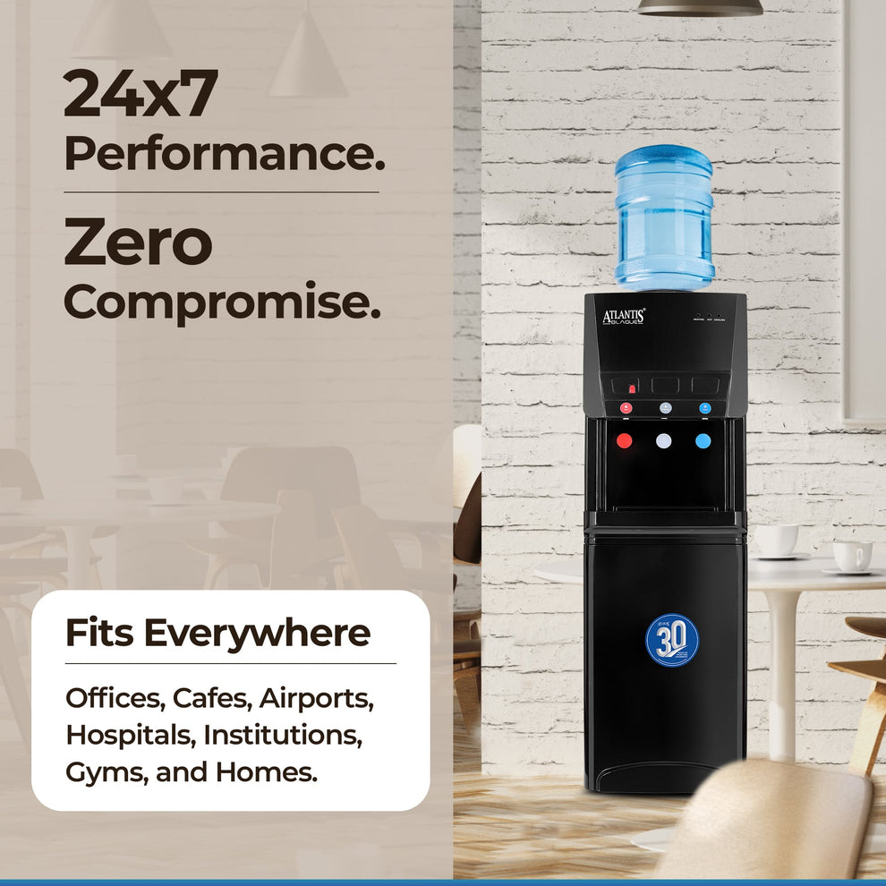 Atlantis water dispenser for office Delhi black model with blue water bottle in modern office setting