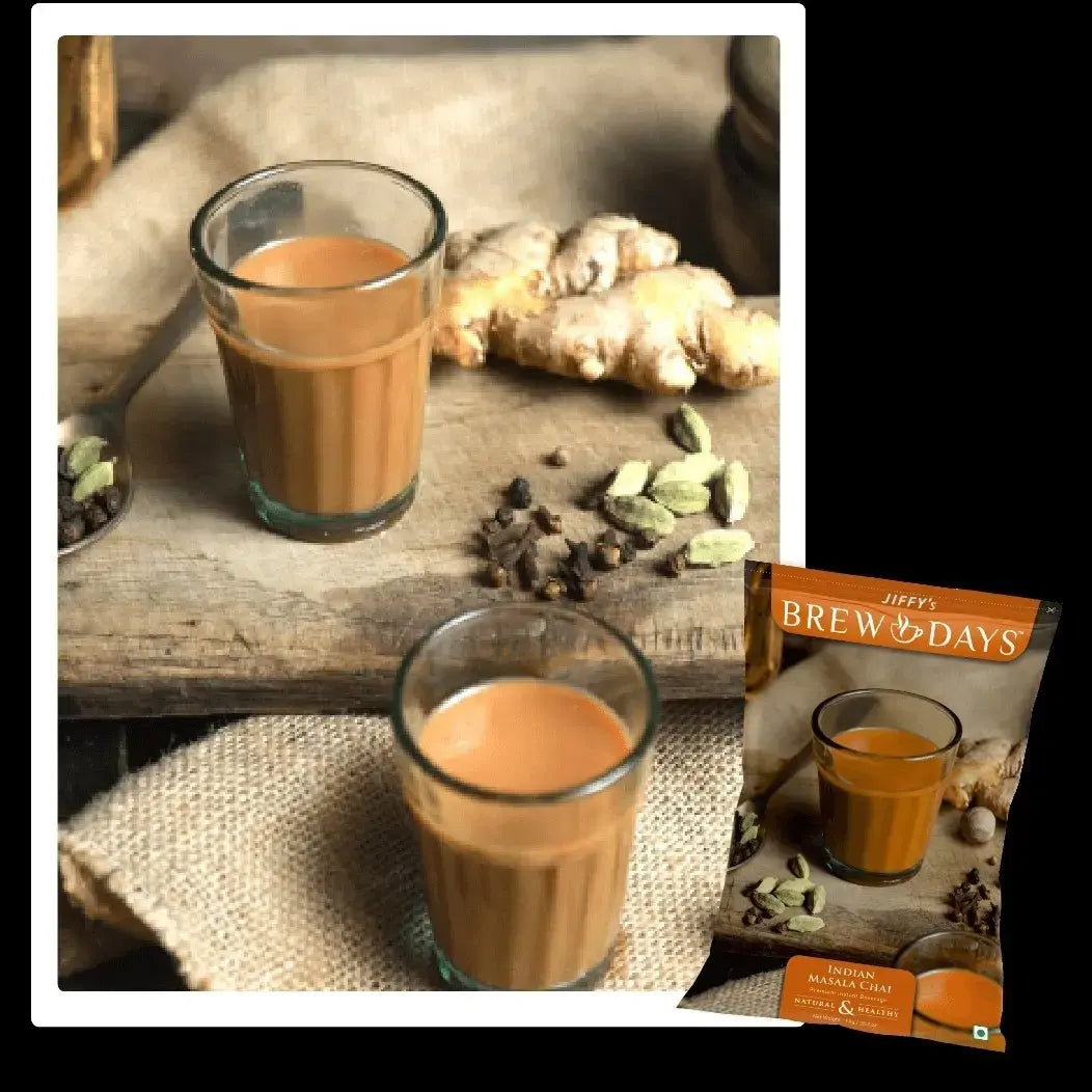 Indian masala tea premix 1kg pack with two glasses of brewed spiced tea and fresh spices on wooden board