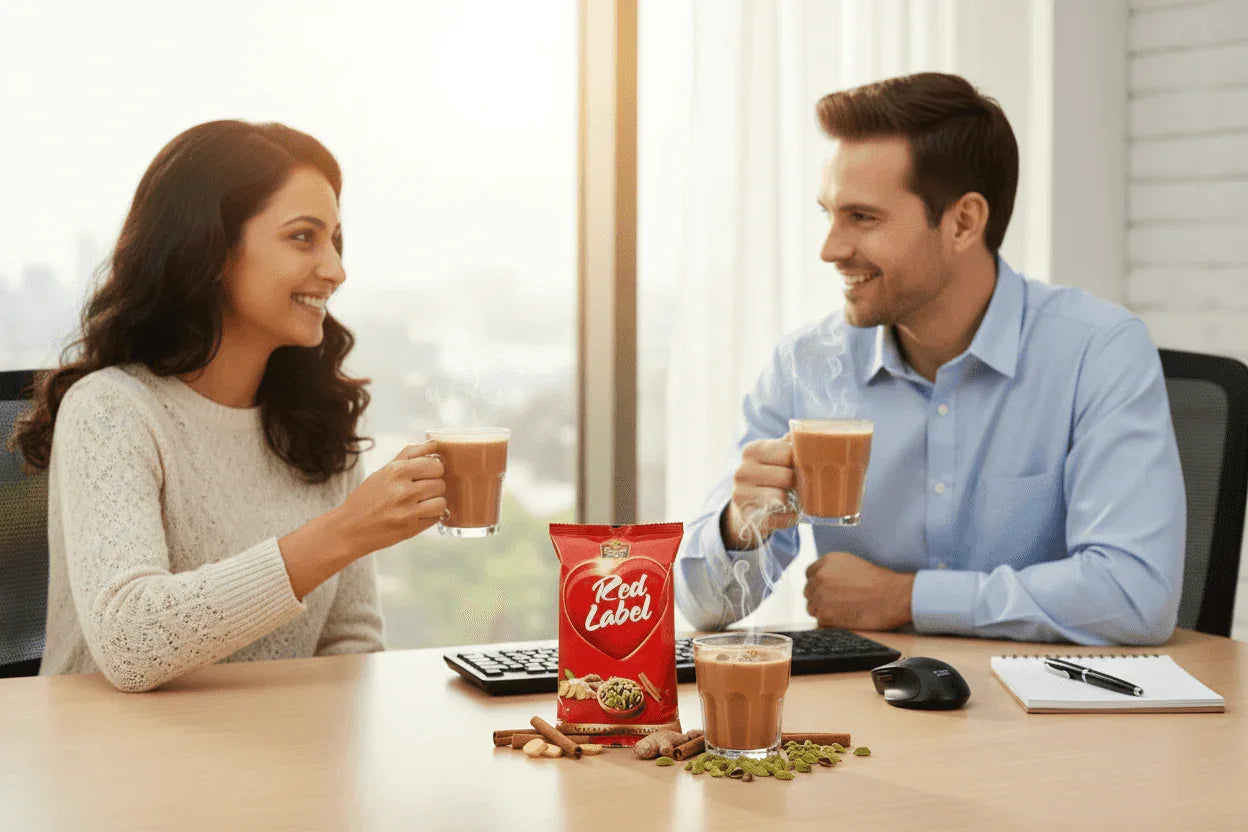 Red label masla tea premix 1 kg pack by COFFEE WALLA with two people enjoying tea in office