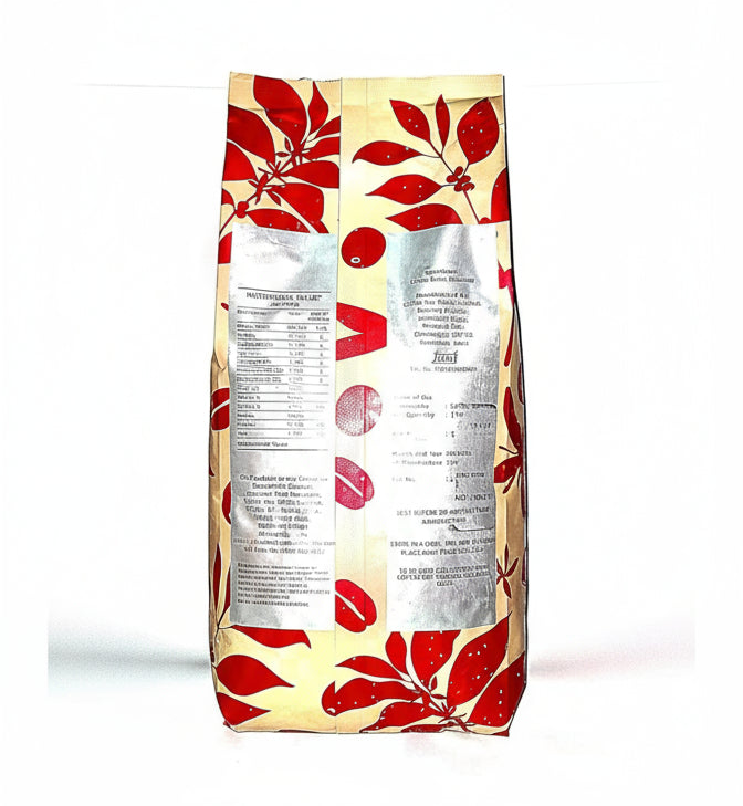 Pack of Cafe Coffee Day beans wholesale with red leaf design on beige packaging from tea coffee vending service