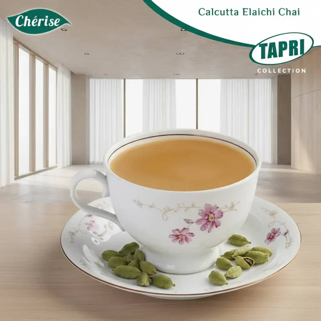 Cup of Calcutta Elaichi chai premix in floral cup with cardamom pods on a saucer indoors