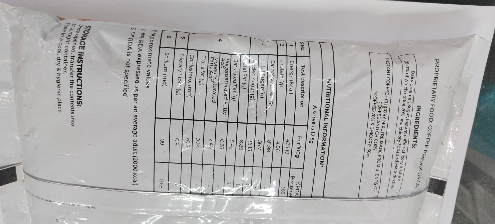 Back view of continental 3 in 1 coffee premix 1 kg packet showing nutrition and ingredient details