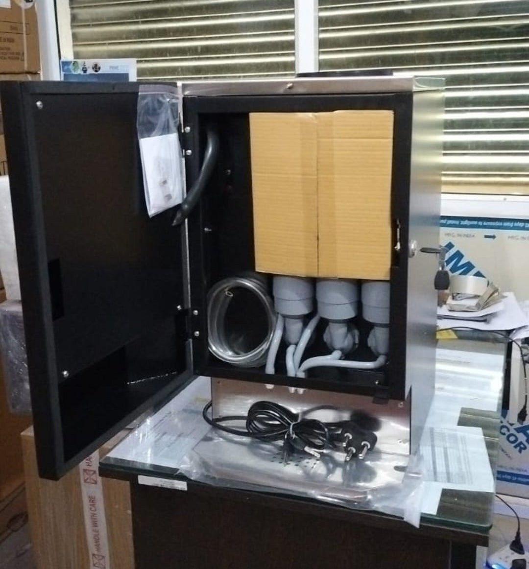 Nescafe 3 Lane Vending Machine with Upi master showing open metal casing and internal components