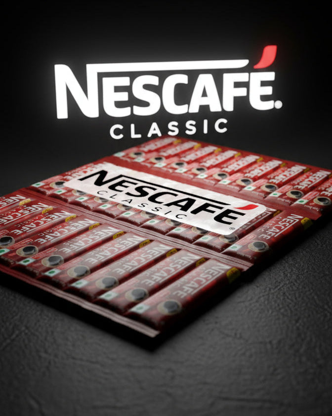 Nescafe Classic instant coffee sachets arranged in a pack with bold branding on a dark surface