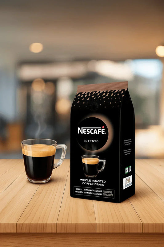 Nescafe Intenso whole roasted coffee beans Delhi package with a glass cup of fresh coffee on wooden table