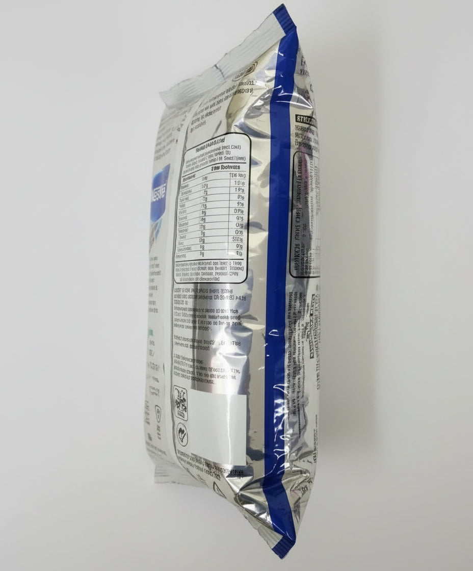 Silver and blue packaging of Nestea Masala Gold instant tea premix showing nutritional information
