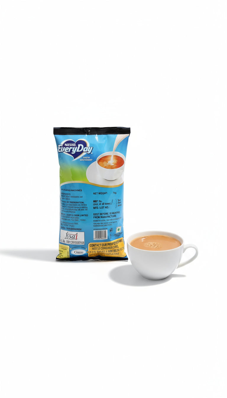 Nestle Everyday dairy whitener 1kg pack with a cup of tea with milk on white background
