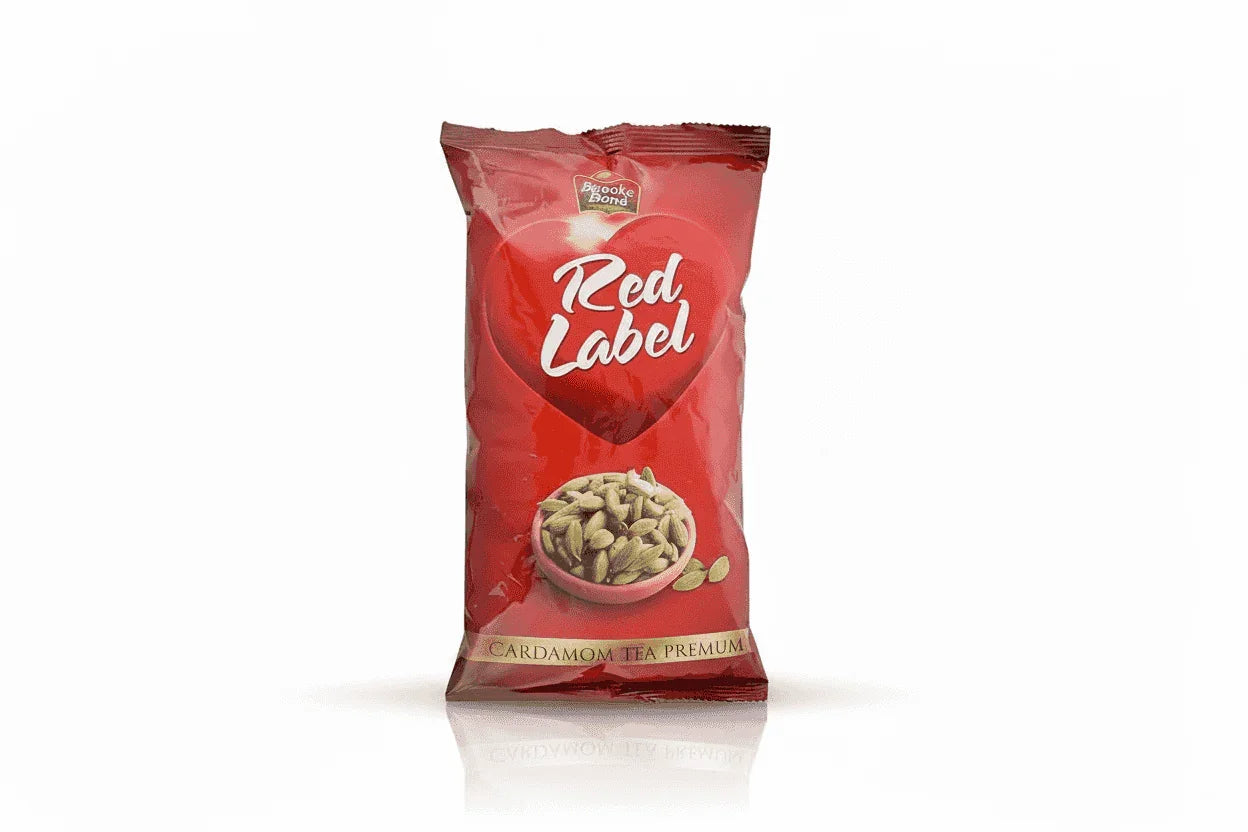 Red label cardamom Tea Premix 1kg by COFFEE WALLA in red packaging with cardamom seeds image